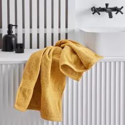 Serviette de bain uni en coton jaune 50×90