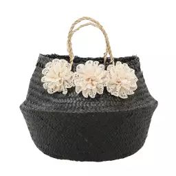 Panier cache-pot en jonc noir avec fleurs blanches